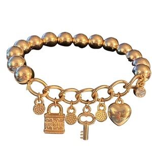 Rose Gold Charm Bracelet (7 charms) Stretch band  Pre-owned  Good condition